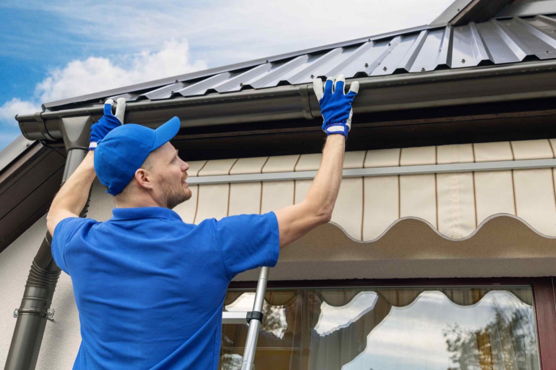 Guttering installation work at a residential roofline